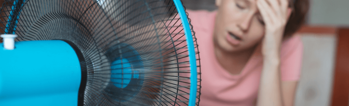 woman hot in front of fan