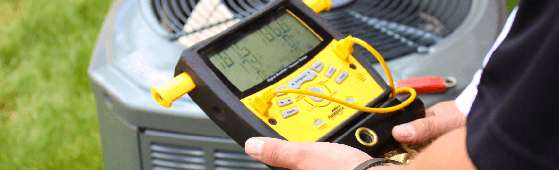 AC repair man checking unit